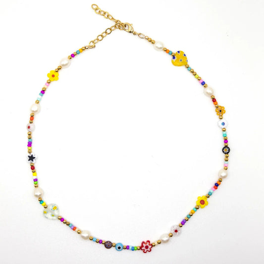 Colorful beaded necklace with floral and star-shaped beads on a white background
